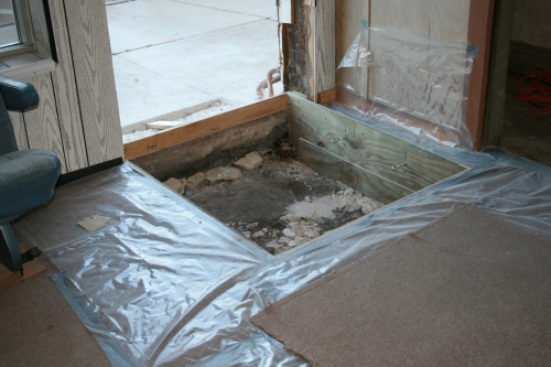 The entrance door and floor are removed