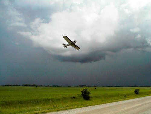 Crop dusting before a thunderstorm