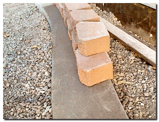 Retaining wall blocks have a lip to hold them in place