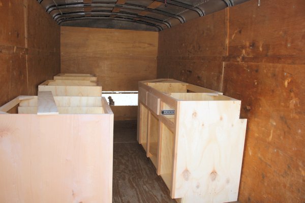 Base cabinets in trailer awaiting stain